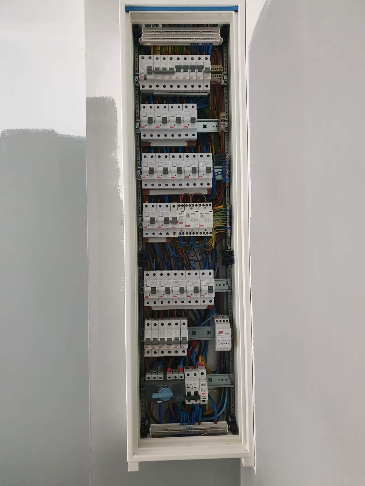 Neatly wired distribution board in a white enclosure, by Elececo Engineering