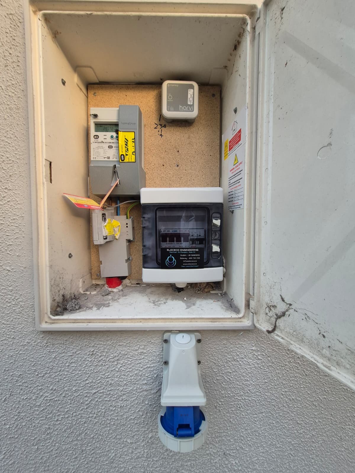 Generator changeover switch and inlet socket fitted to an exterior wall