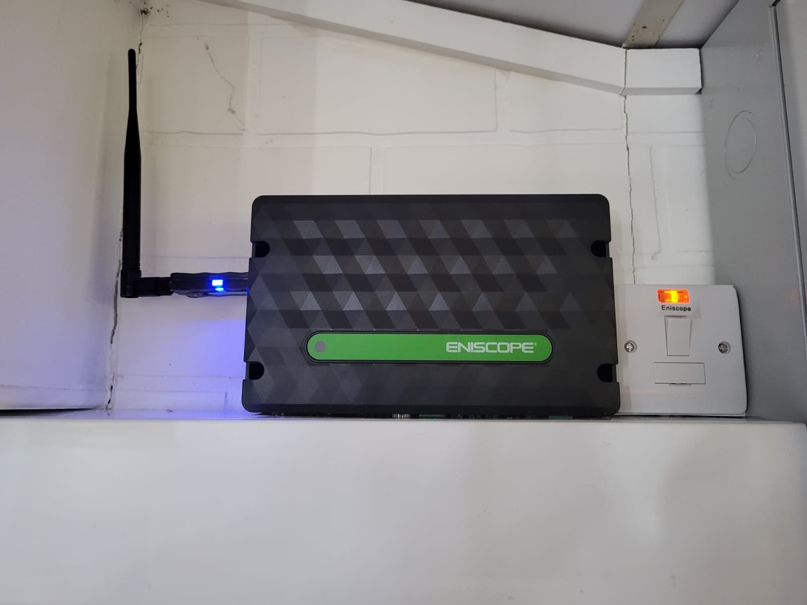Eniscope energy monitoring hub installed on a utility shelf, by Elececo Engineering