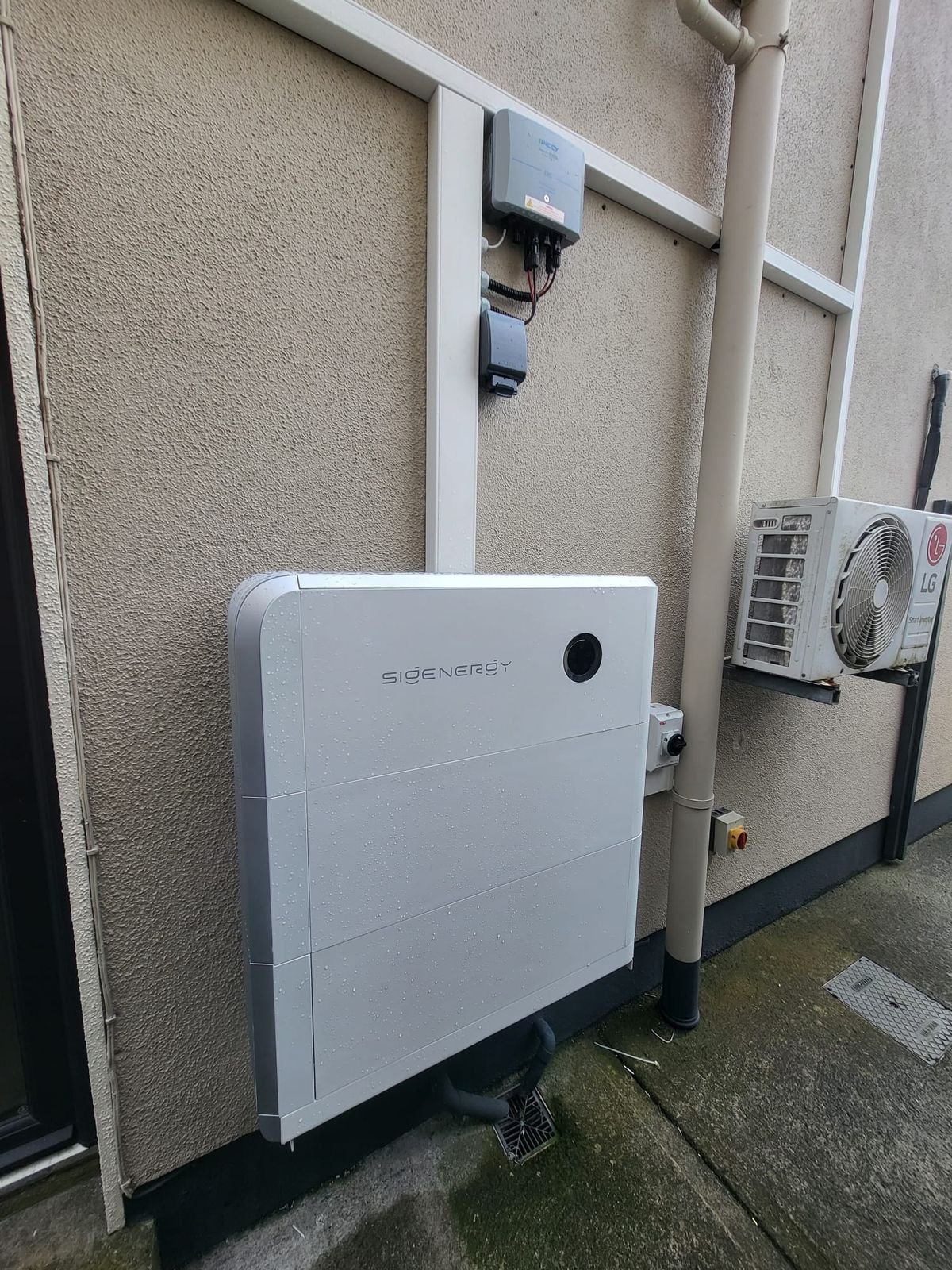 Sigenergy battery unit mounted on an exterior wall