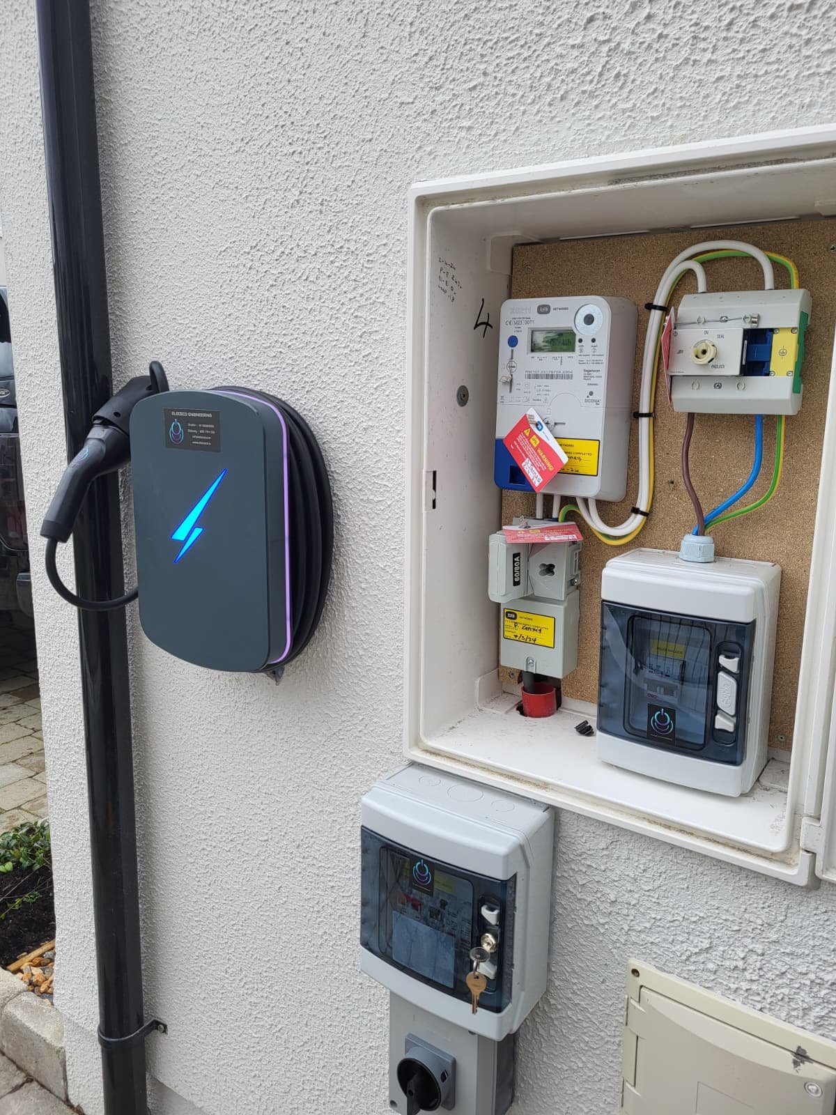 Wallbox EV charger installed beside the meter box and isolator