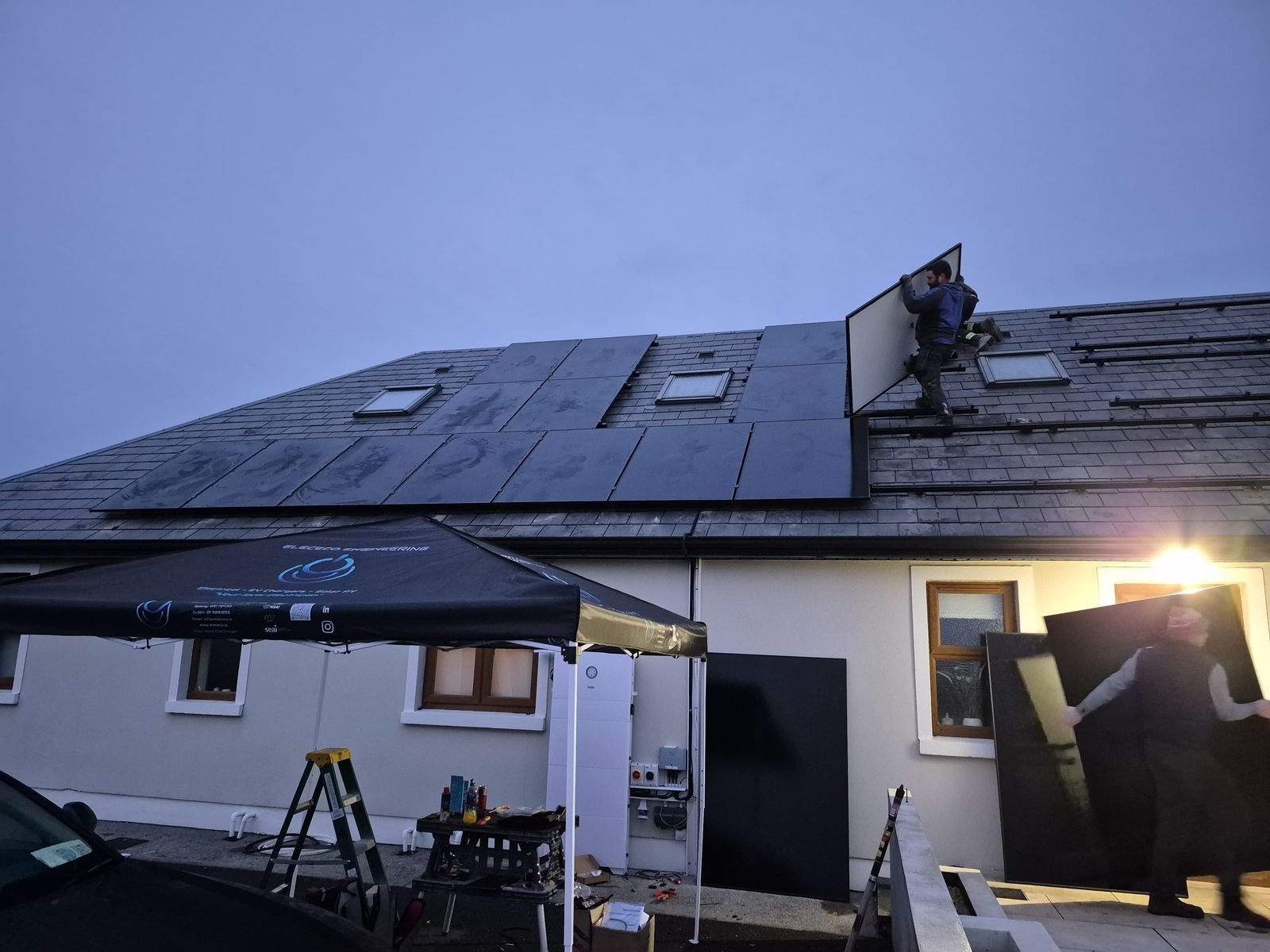Elececo Engineering team installing Solar PV panels on a house roof
