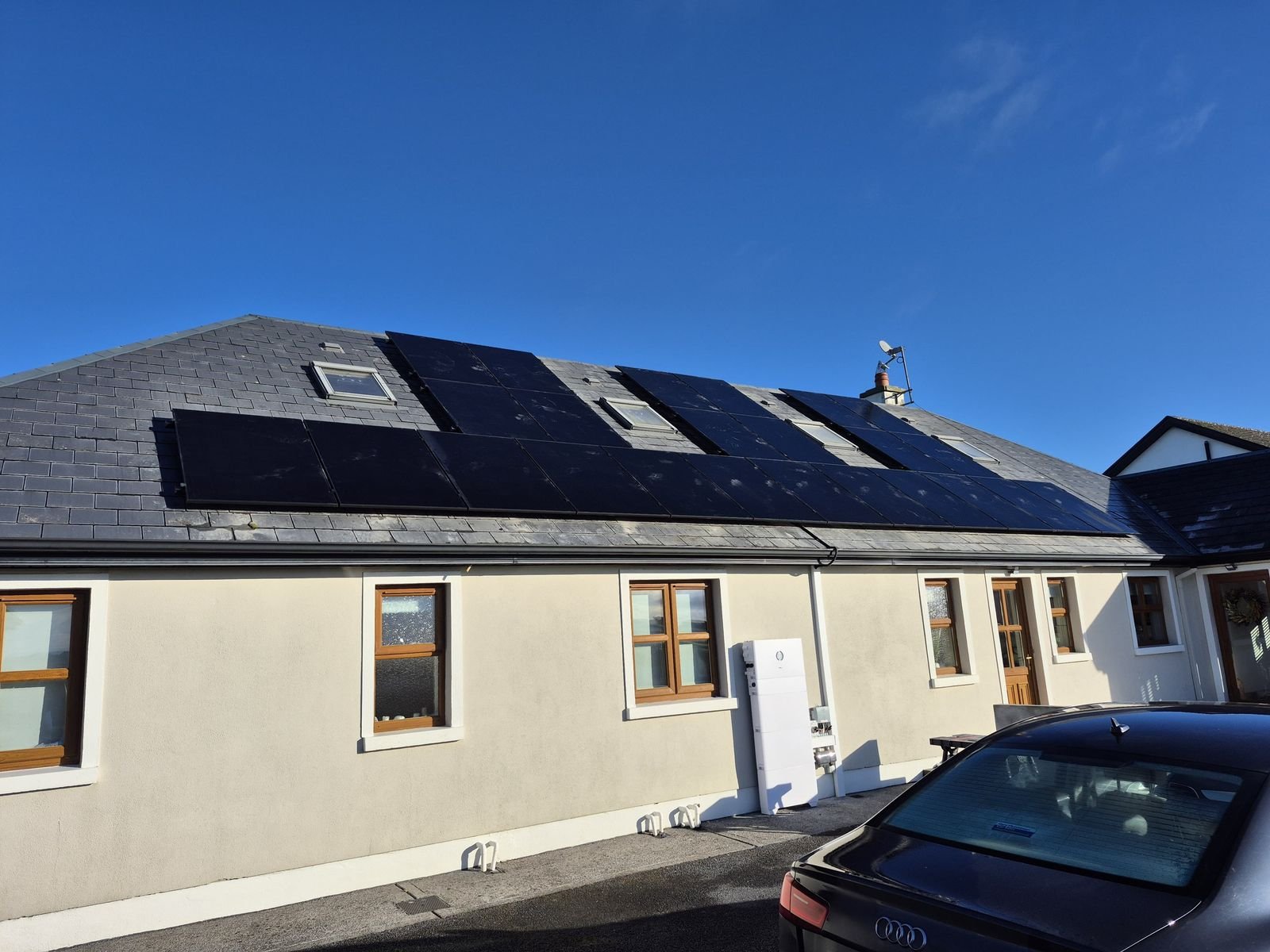 Solar PV panels across the roof of a dormer bungalow, by Elececo Engineering